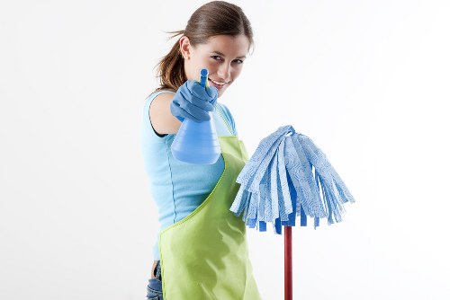 Professional cleaner preparing a Bromley home for a fresh, tidy finish
